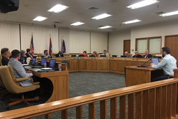 group of people sitting in a courtroom