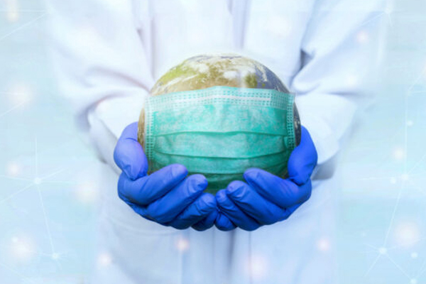 scientist holding the world, world is wearing a mask