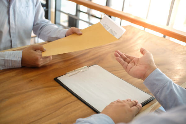 two people talking over paperwork