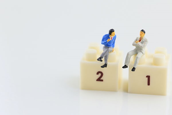 two characters sitting on top of two lego blocks