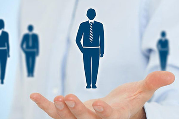 person holding the graphic of a person in a suit