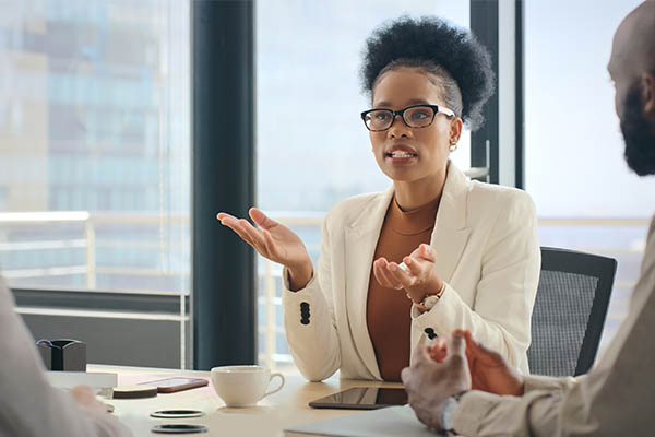 woman holding up hands, listening